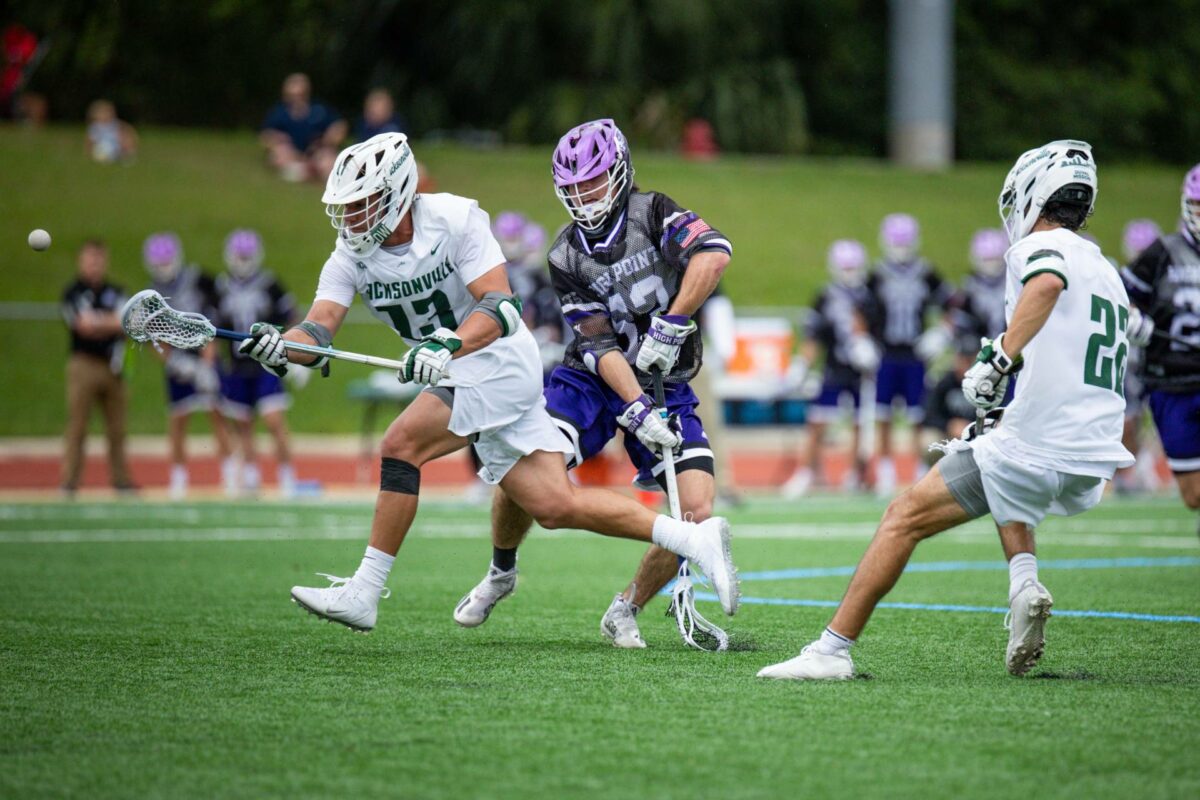 men's lacrosse player number 13 at a game