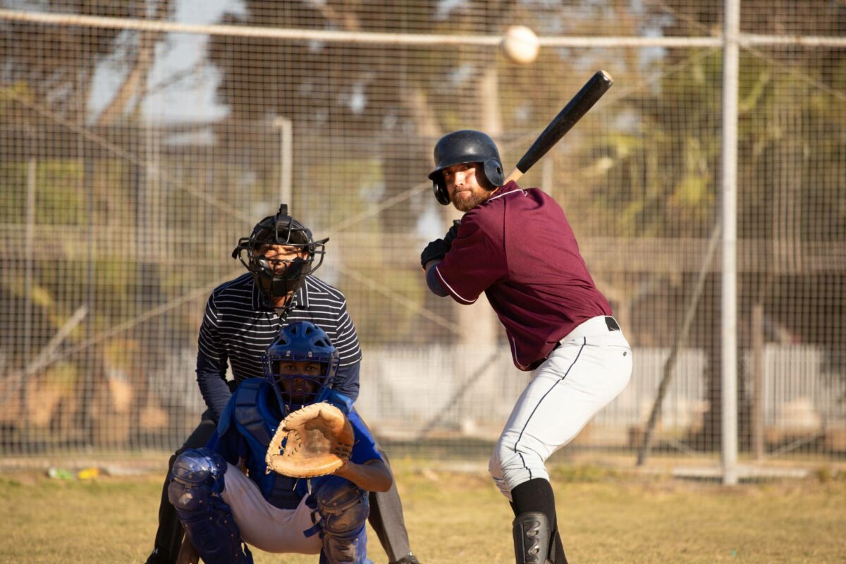 Baseball batter hits the ball